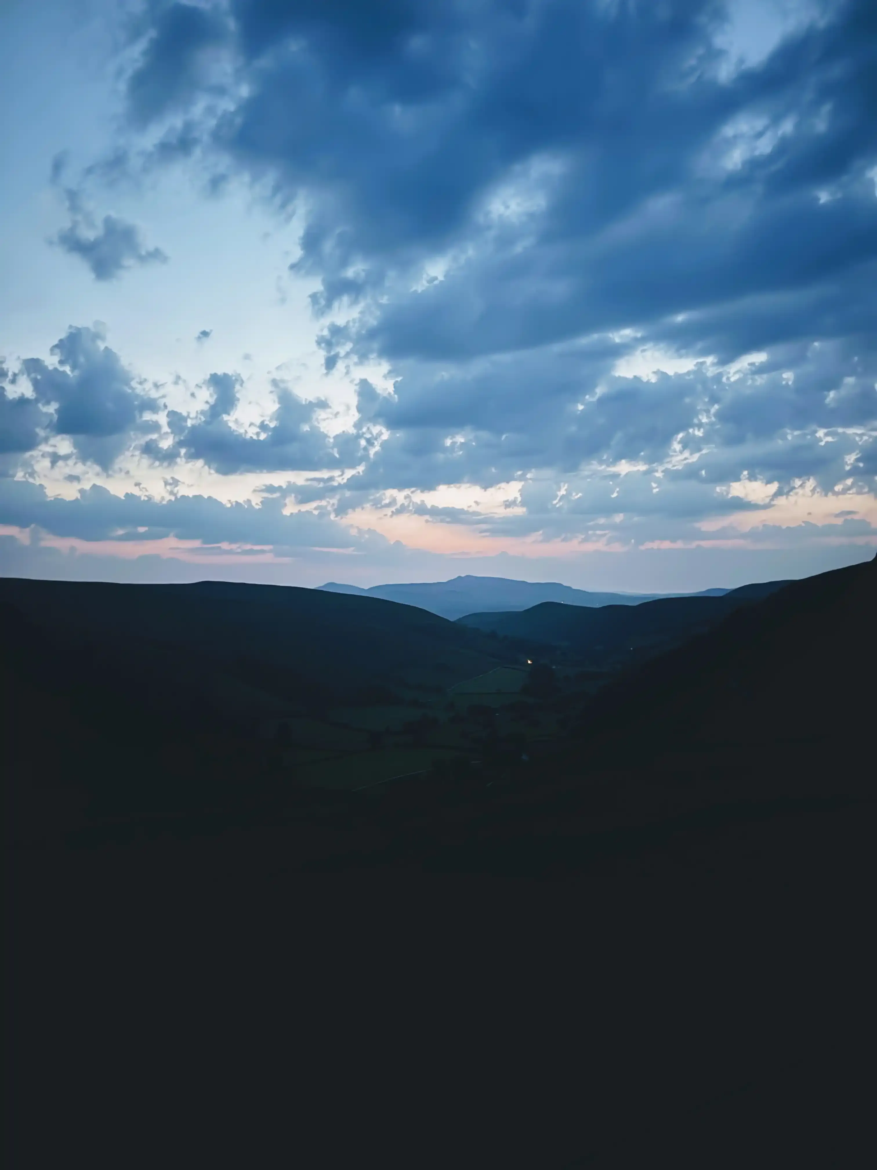 At Snowdonia National Park around 10 PM on the second day. The camera exposure makes it look bright, but it was much darker. That light ahead is another randonneur.